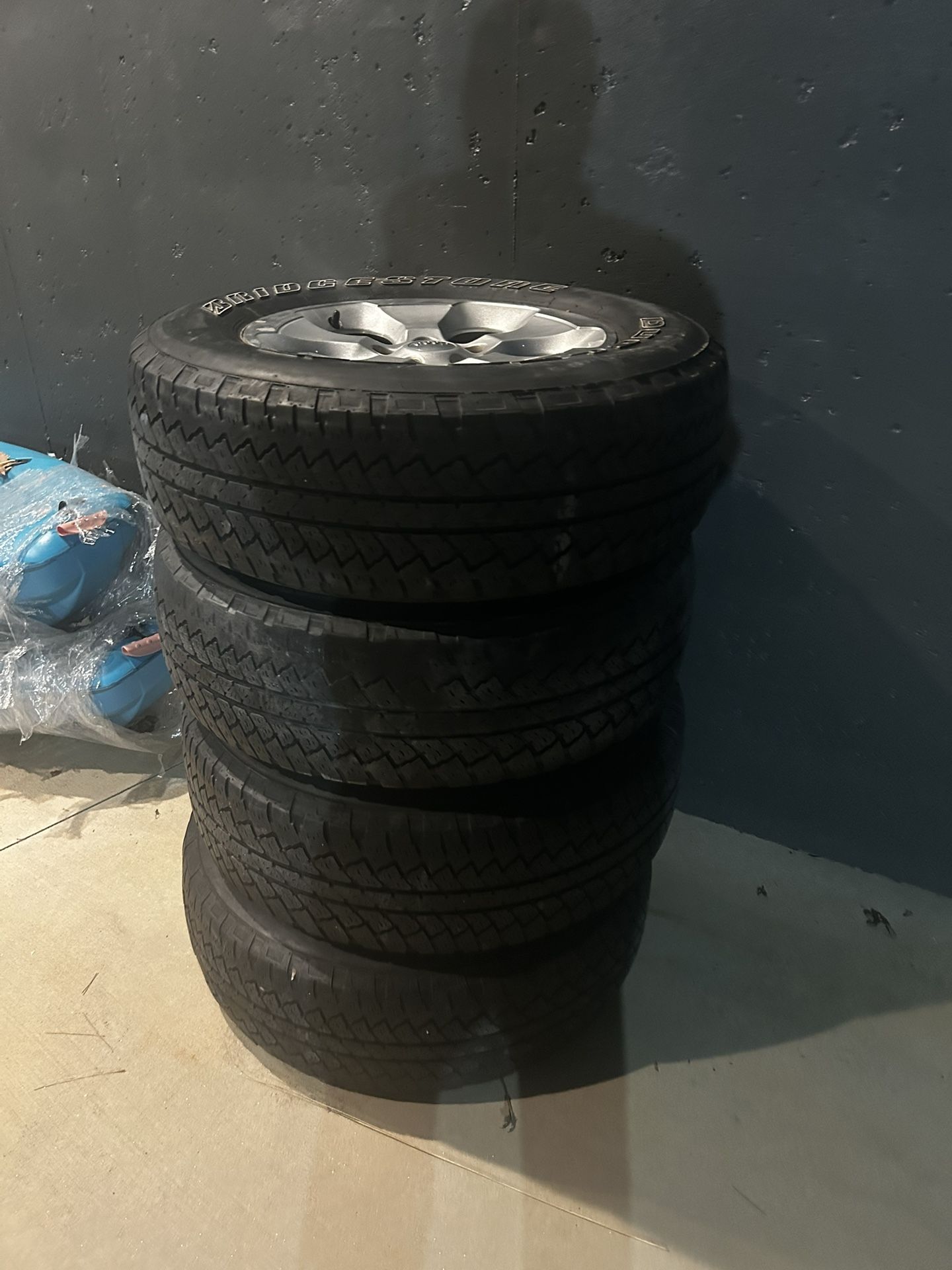 4 18in OEM Jeep wheels with Bridgestone Dueler A/T Tires