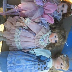 Set of vintage ceramic dolls with stands are for $50