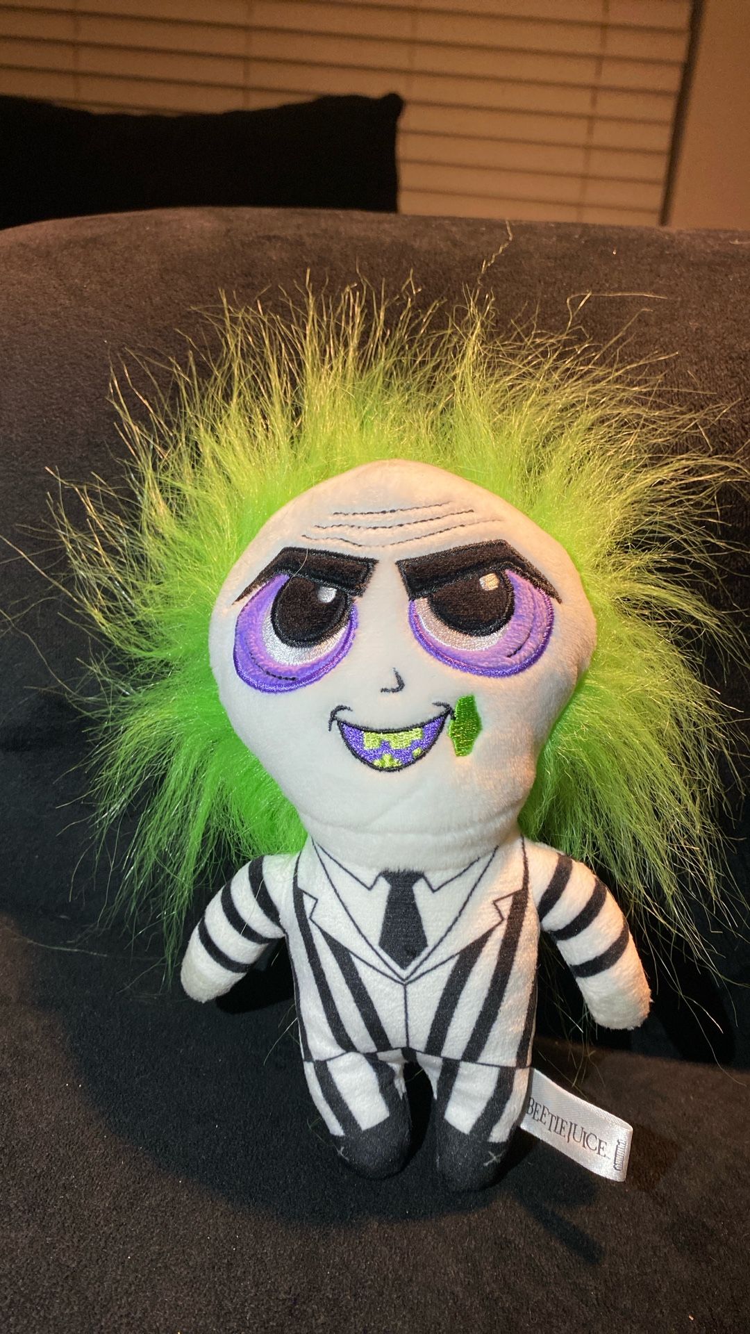 Beetlejuice plush excellent iconic character signature black and white striped suit, black boots, and wild green hair. The doll has a detai