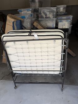 Folding rollaway guest bed with mattress