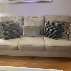 Gray sofa With Navy Blue & Gray Pillows