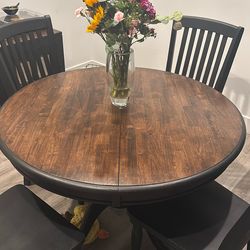 Dining Table With 6 Chairs As Well As A Leaf Insert