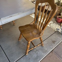 4 Wooden Chairs And A Wooden Table 
