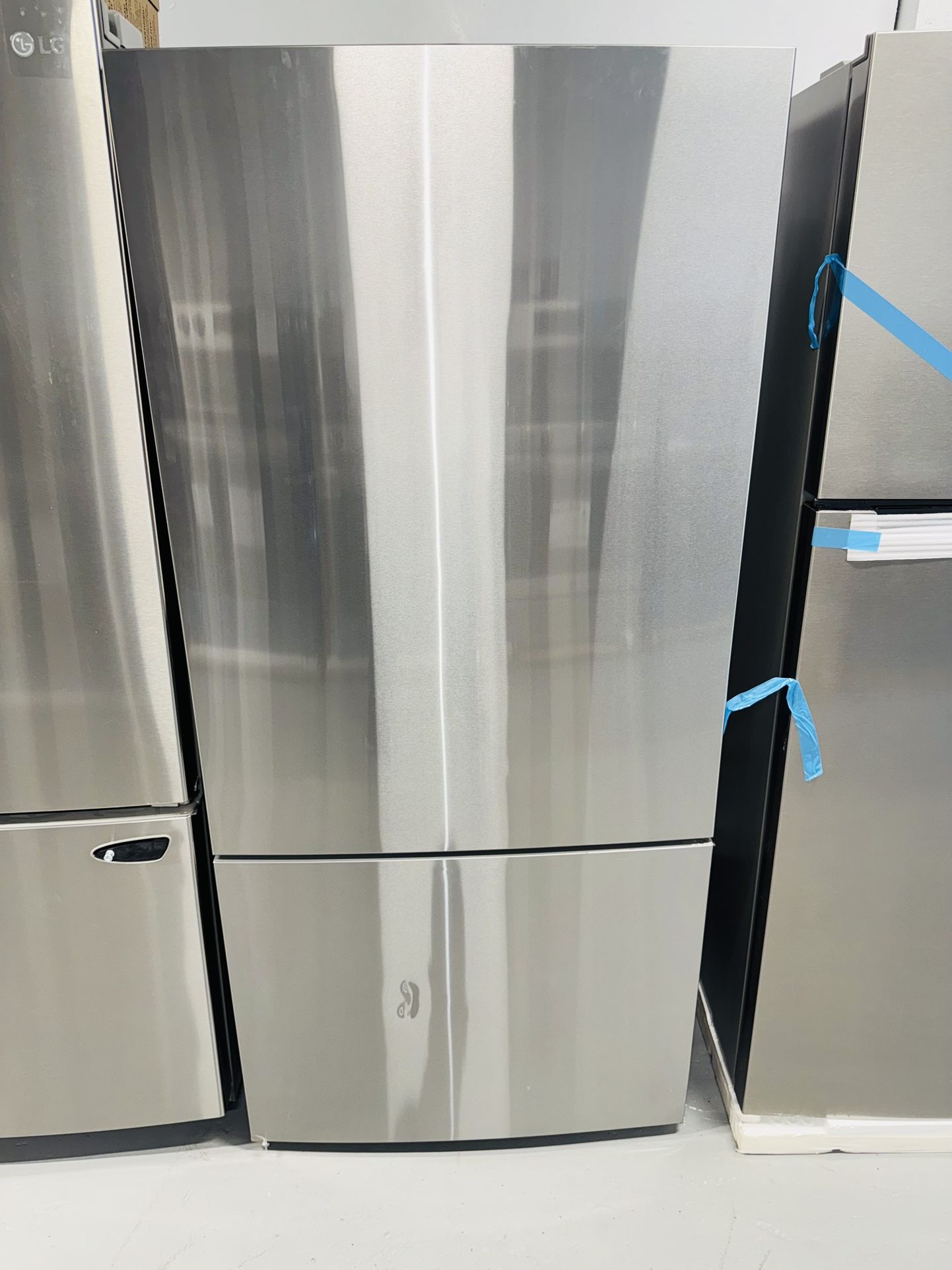 GE new refrigerator 31x68x24 stainless steel one year warranty from the company