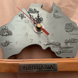 Souvenir Australia Map Desktop CLOCK   5" high by 6" wide face is embossed with landmarks, flora and fauna and raised city names Wooden base  with "Au