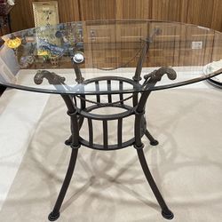 Oval Glass Patio Table. - 45” long x 32” wide 