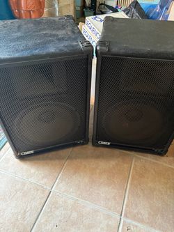 A pair of Crate PE-12H PA speakers & Stands