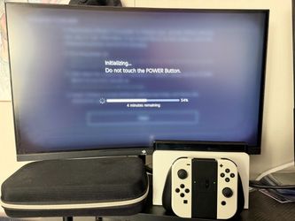 Nintendo Switch OLED White with Carry Case and gaming monitor