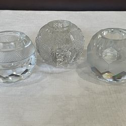 3 decorative cut crystal candleholders.