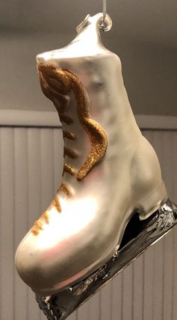 Glass blown ice skating Christmas ornament.