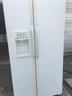 Ge white side by side refrigerator