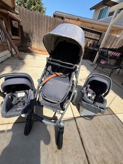 uppababy stroller and two car seat s