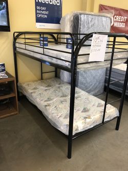 Bunk bed with mattresses