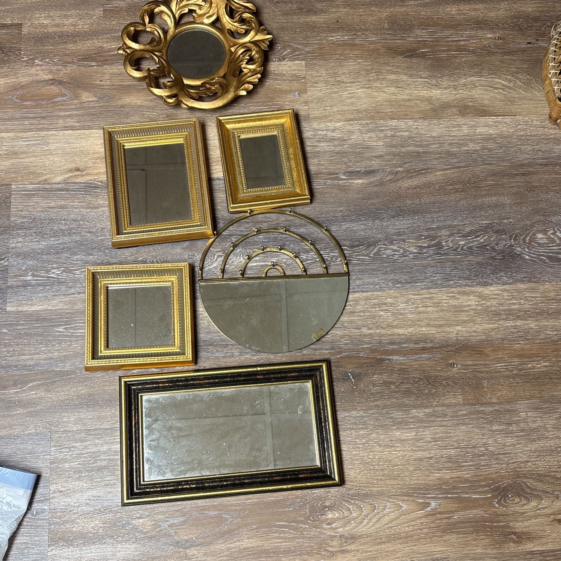 Lot Of gold mirrors.