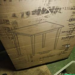 Winsome Wood Groveland dining table in a walnut finish, made from solid wood.