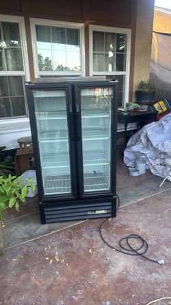 True Refrigerator GDM-30-HC-LD black 30 inches wide 54 inches tall, 23 and a half inches from front to back