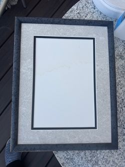Frame with matting for 9” by 6” photo
