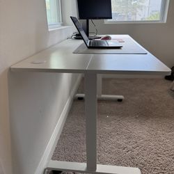 Electric Standing Desk Adjustable Height, 55x24 Inches  4 Preset Heights, Rolling Wheels 