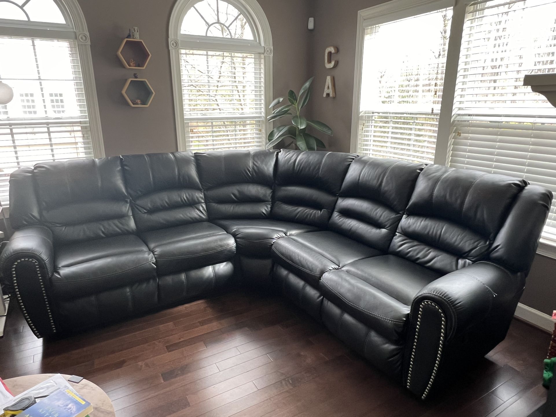 Ashley's Black Faux Leather Sectional Couch