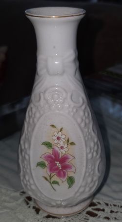 Vintage The Porcelain Cameo Vase from Amhearst Manor Collection. 6.5 inches tall, 3 inch opening. Embossed bow and grape motif with floral cameo medal