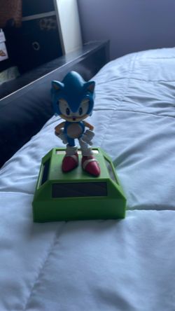 Toy that has solar panel panels to kick legs up and down and open eyes