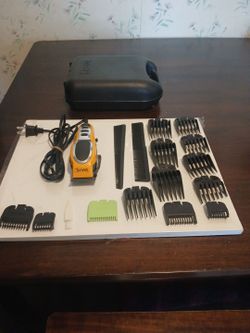 WAHL Close cut hair clippers w/storage case and guide combs