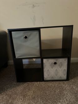 Decorative shelf with cube storage spaces