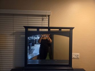 Blue bedroom dresser with mirror