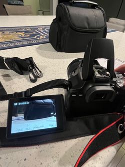 Canon EOS Rebel SL3 DSLR Camera Bundle – 18-55mm Lens, Bag, Charger & Battery