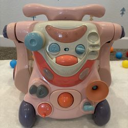 Honeys Joy Sit to Stand Walker Toy Car with Sounds and Lights