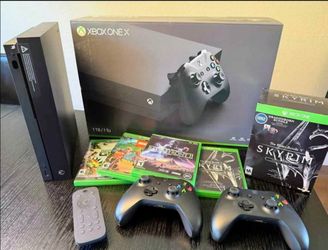 Practically New Xbox One X with 5 Games