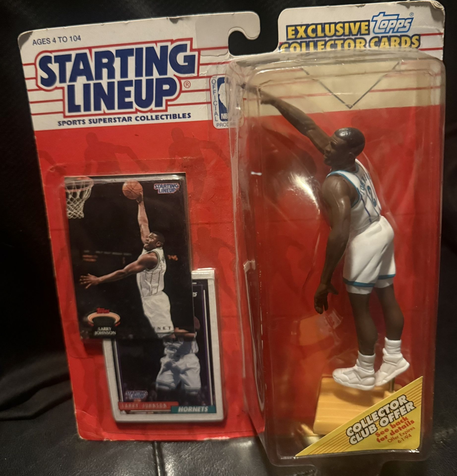 This is a 1993 Kenner NBA Basketball Starting Lineup Larry Johnson action figure in a Charlotte Hornets uniform