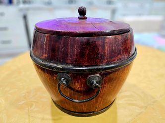 Vintage Chinese wooden container with metal design.