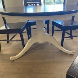 Pottery barn dinning table with four Pier One wooden chairs