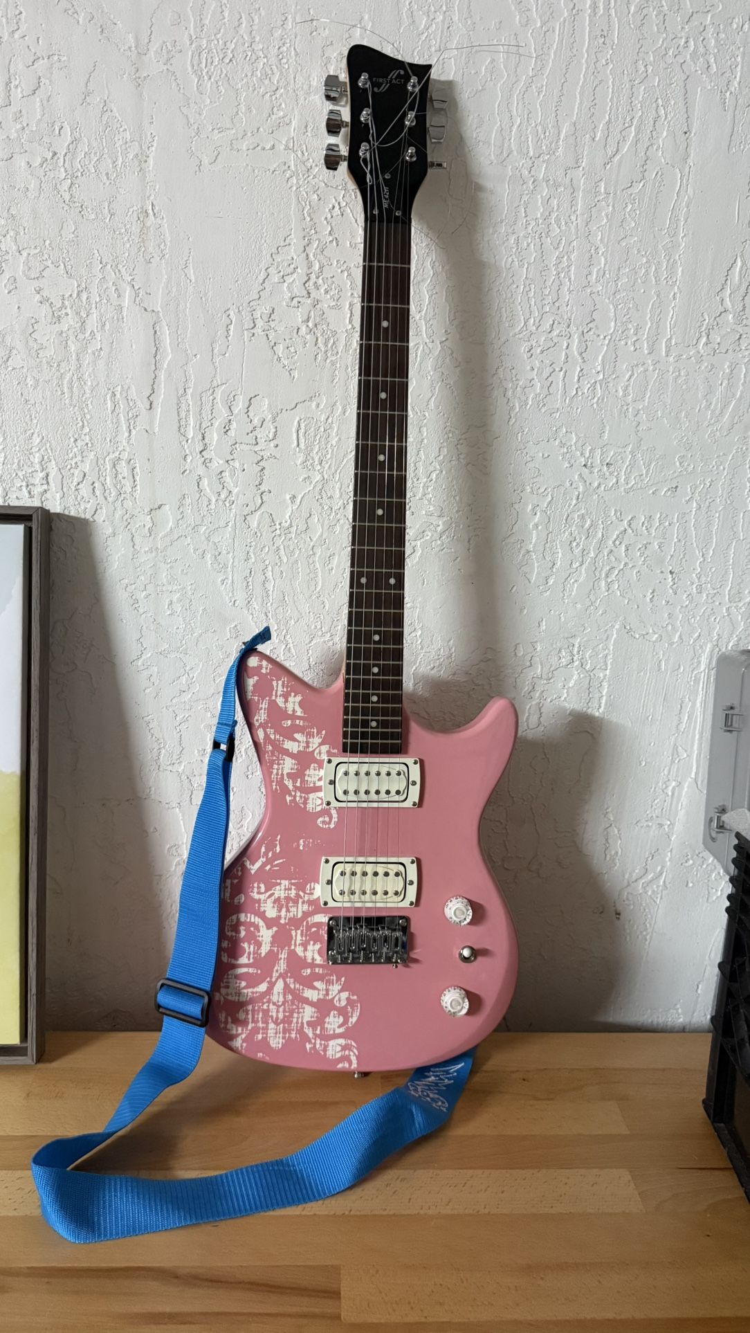 Pink Electric First Act guitar