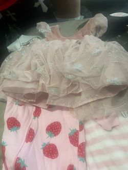 Variety of girl, clothes, trash bag full