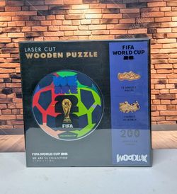 2026 FIFA World Cup wooden jigsaw puzzle; a gift for soccer fans ("WeAre26" edition), ball-shaped design, 200 pieces.
Officially licensed product, 5 m