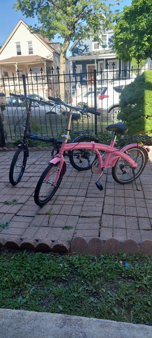 To folding bike. Pink and black