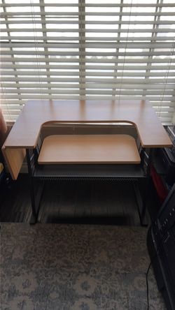 Sewing table for sale 24 inches wide by 36 inches long and can extend out to 45 long excellent condition asking $45