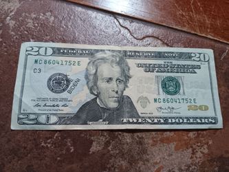 $20 bill says " FUCK JOE BIDEN! " stamped on the front and back