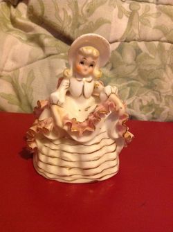Vintage porcelain bell of girl in dress