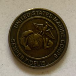 This is a United States Marine Corps challenge coin featuring the Eagle, Globe, and Anchor emblem.