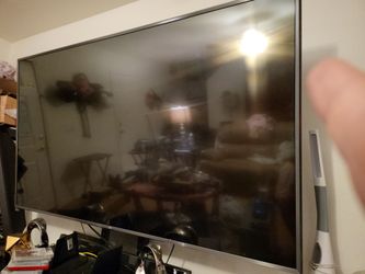 86inch monster tv with steel stand and glass entertainment center