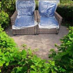 Outdoor rattan arm chairs set of 2.