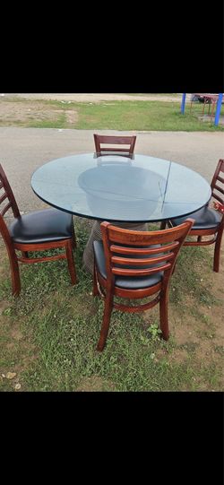 Glass table with 4 chairs
