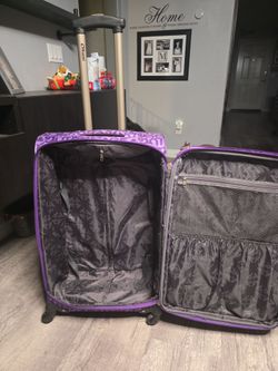 Large purple suitcase