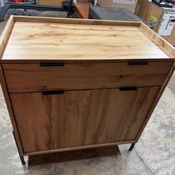 Wooden storage cabinet with drawer