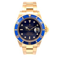 Rolex Submariner 40mm Pre-owned Rolex Submariner. Has a 40mm 18k yellow gold case with a 18k yellow gold oyster bracelet. Features a blue dial and blu