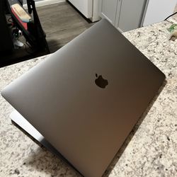 MacBook Pro 15-inch (Mid 2019) – Intel i7, 256GB, 16GB RAM (Lightly Used) 