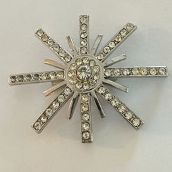 Elegant Silver Starburst Brooch